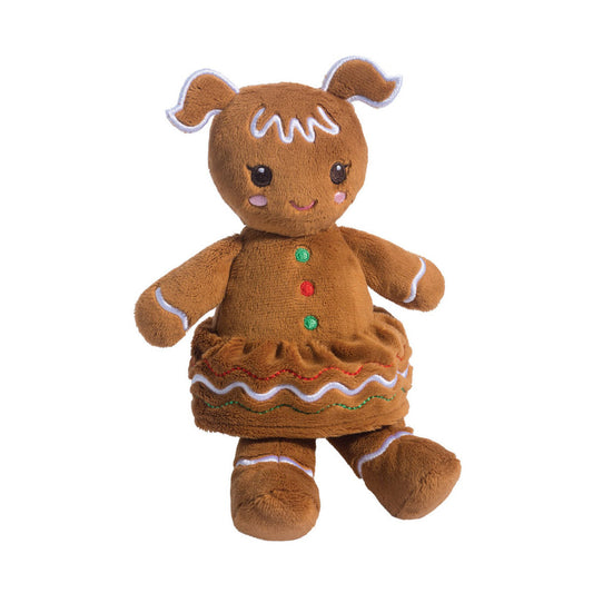 Det här är en pepparkaksflicka från Douglas Cuddle Toys. Kort, jämn brun päls, matt och tät, med små rosa broderade kinder. Huvudet har två vågiga öronliknande utskott med vit kant och vitt glasyrliknande broderi över pannan. Runda mörkbruna ögon med vita glansprickar, ingen synlig nos och ett litet rosa broderat leende. Volangkjol med vågig kant och tre runda broderade knappar i grönt och rött. Korta raka armar och ben, stående, glad min.